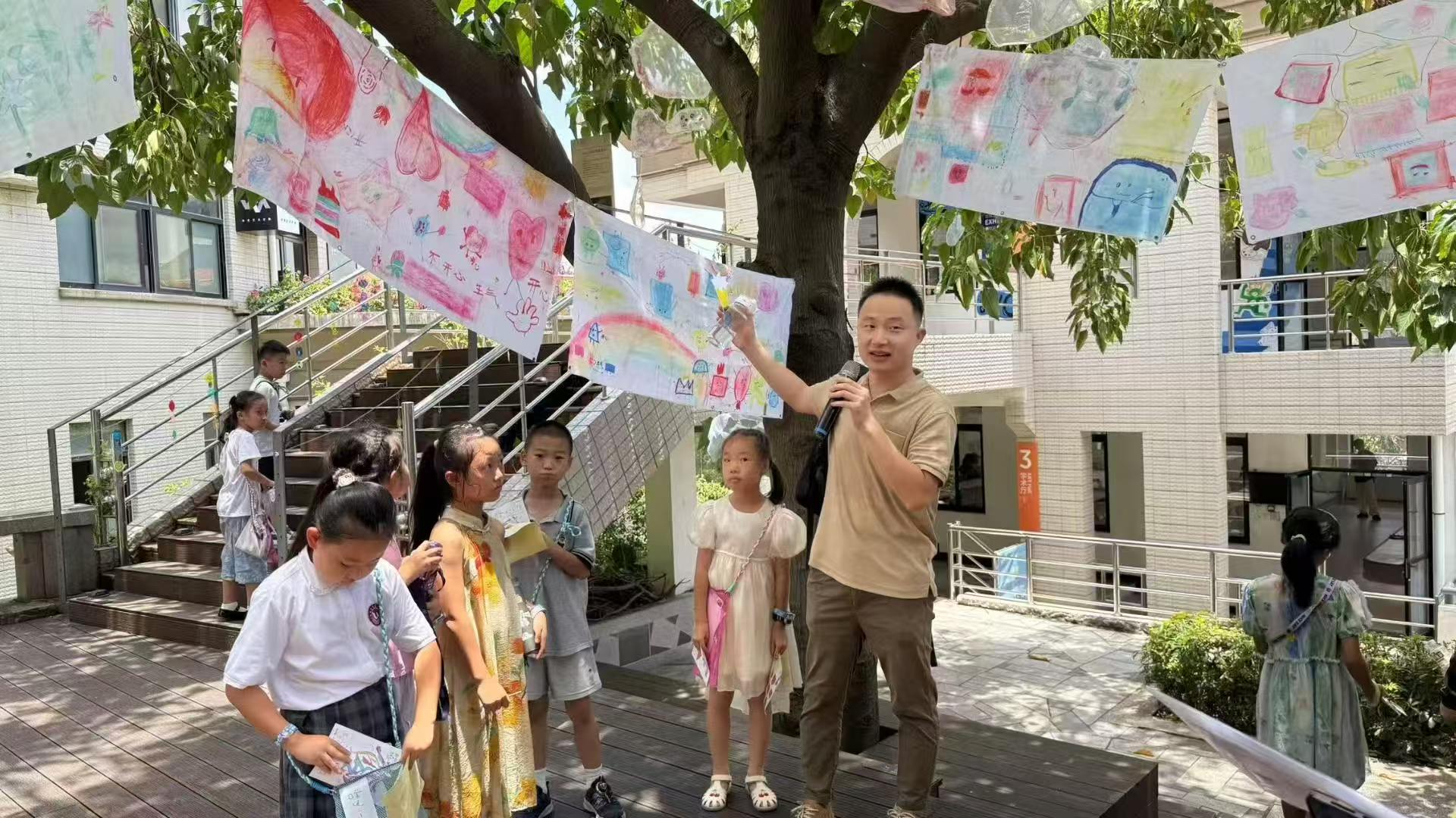 Outdoor children's art tour under a tree