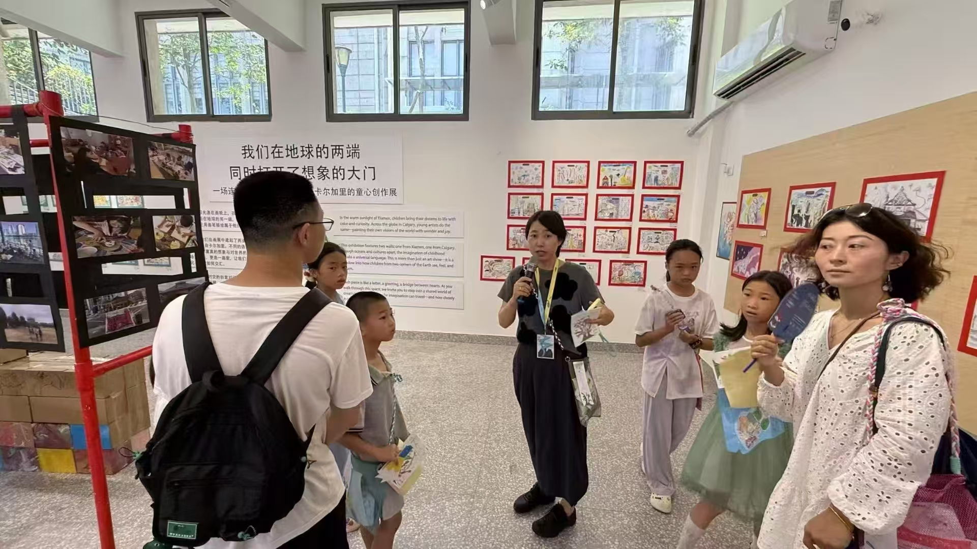 Visitors listening to a guide in the exhibition room