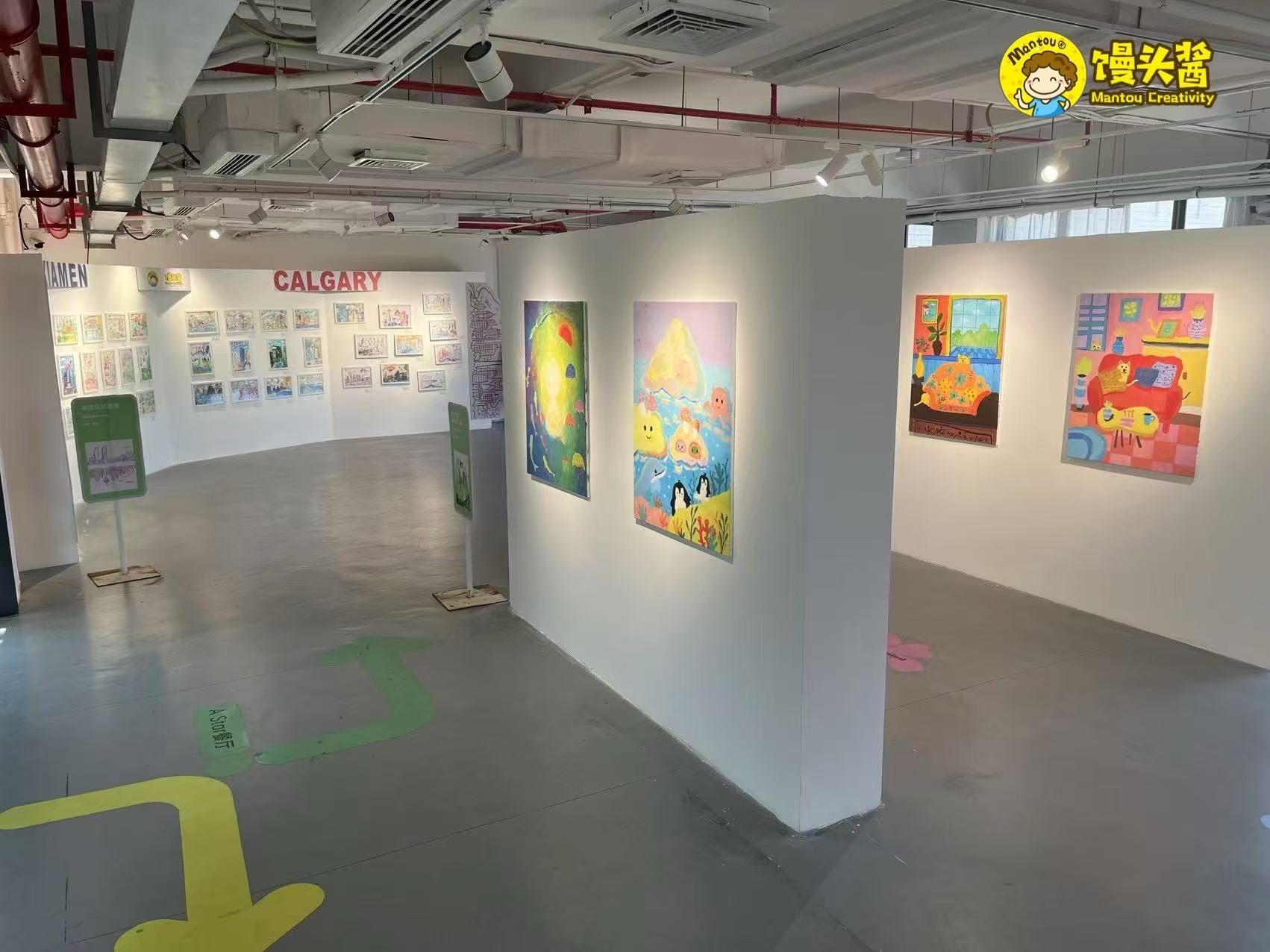 Gallery route with paintings and exhibition walls