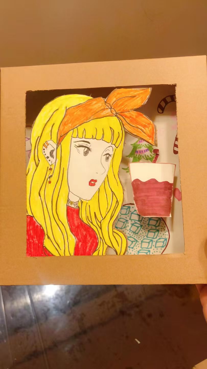 Student artwork of a blonde character with a bow in a cardboard frame