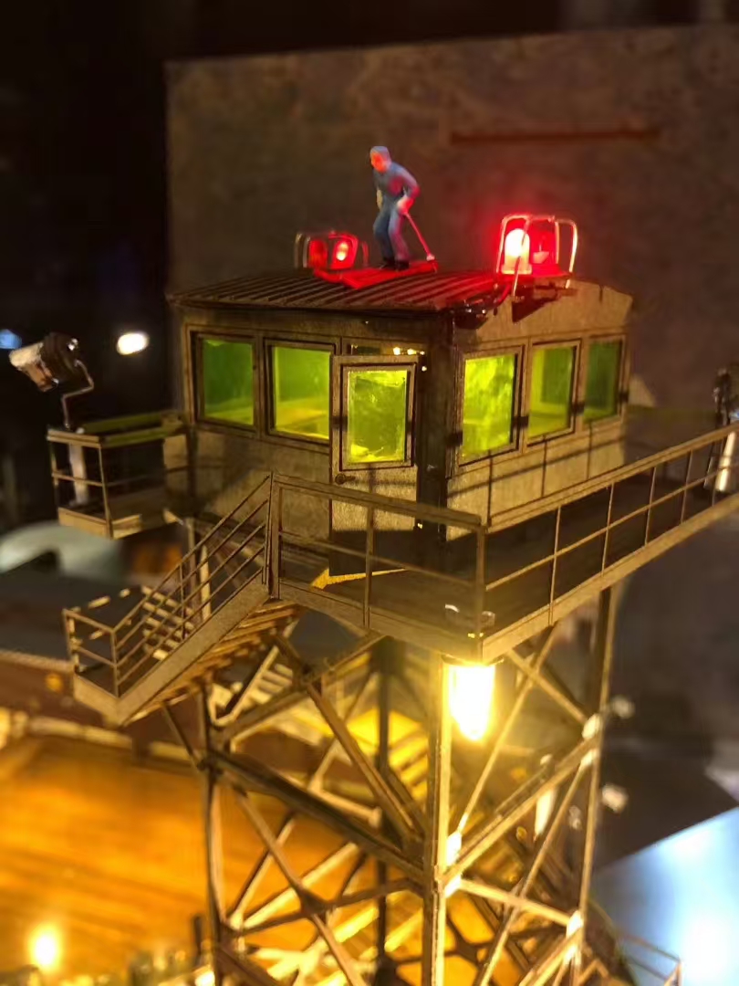 Handmade watchtower model with red lights