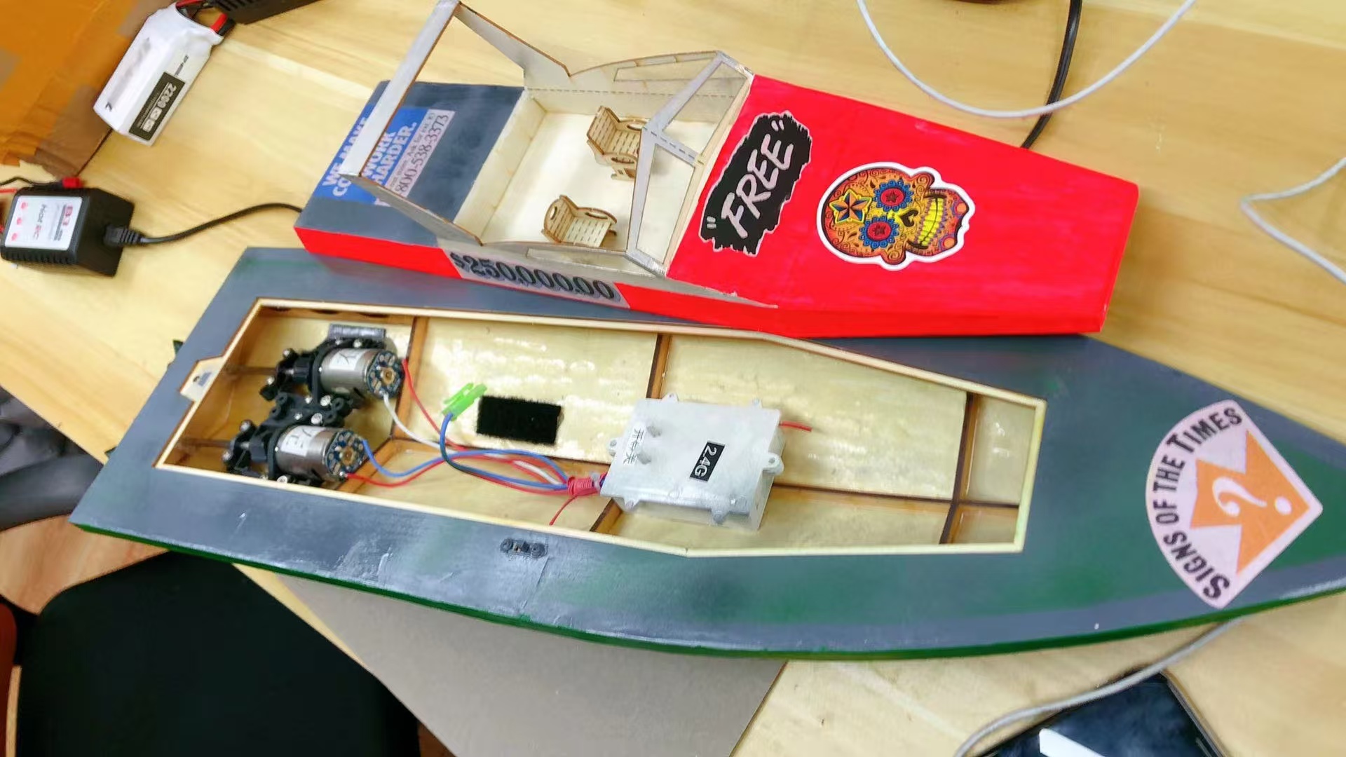 Handmade boat model with visible motor mechanism