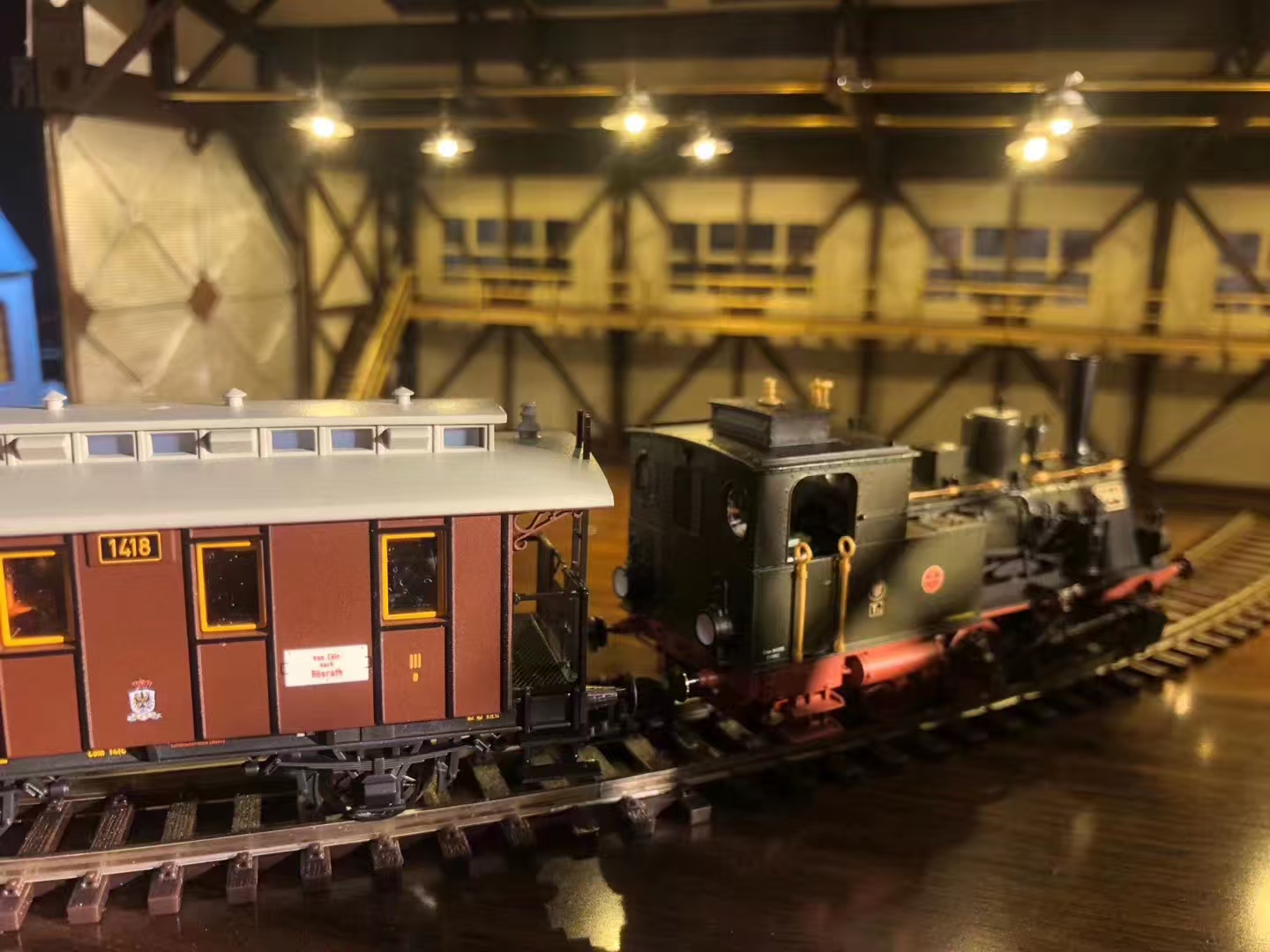 Detailed handmade train model in a warm station scene