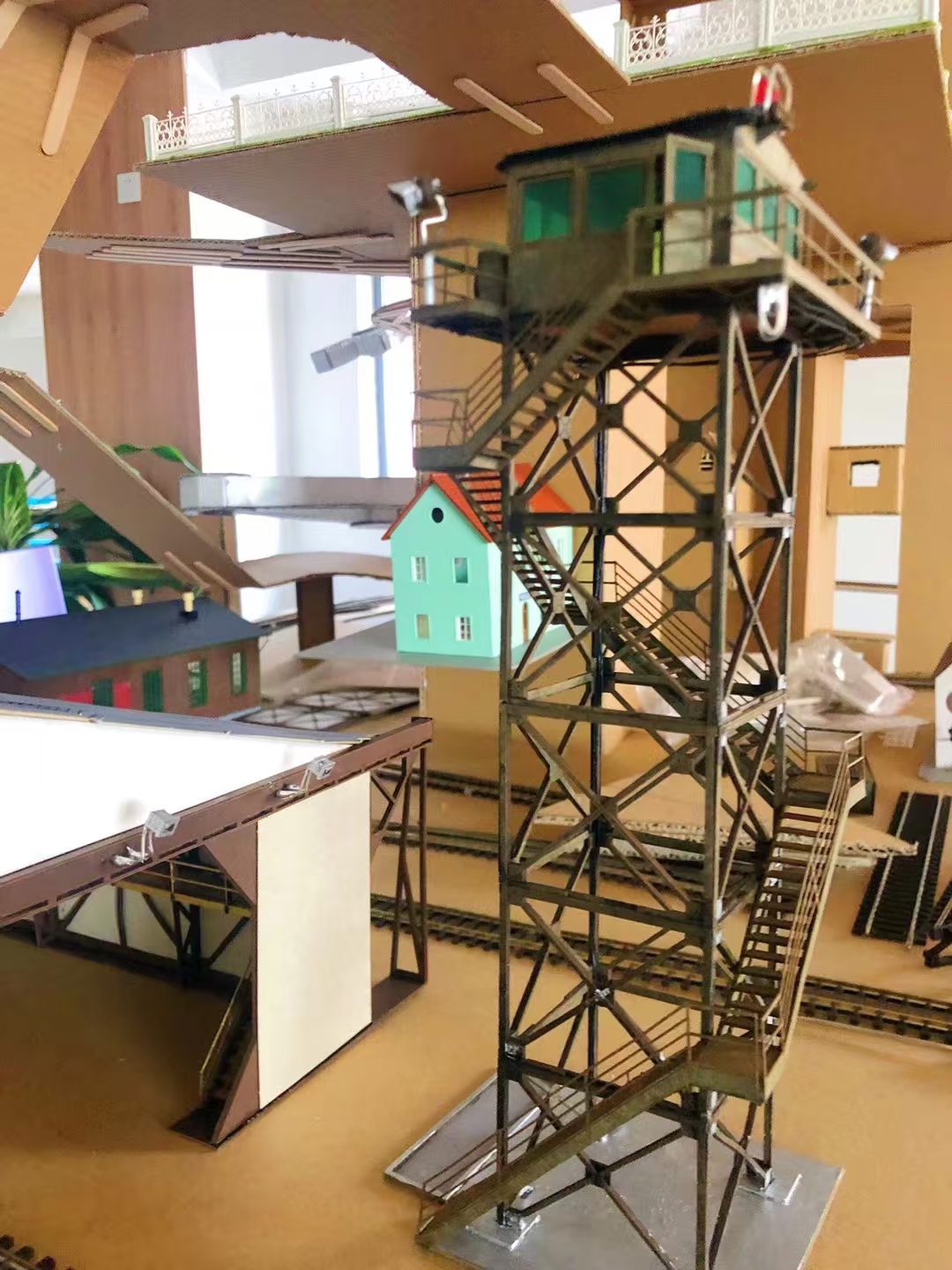 Handmade tower model in a studio setting