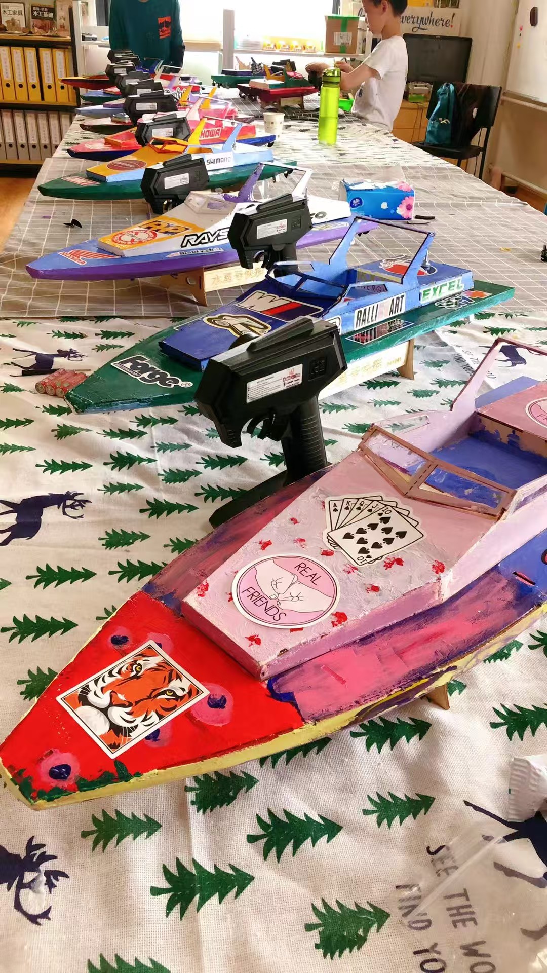 Colorful handmade boats made by students