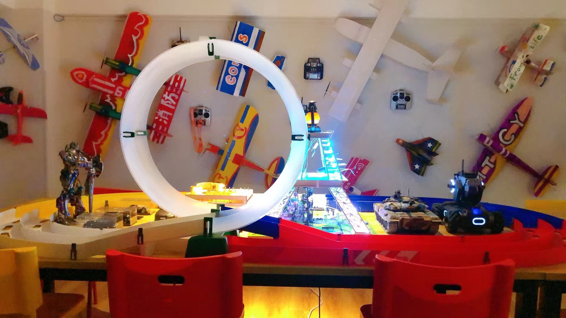 Colorful handmade aircraft display with glowing loop