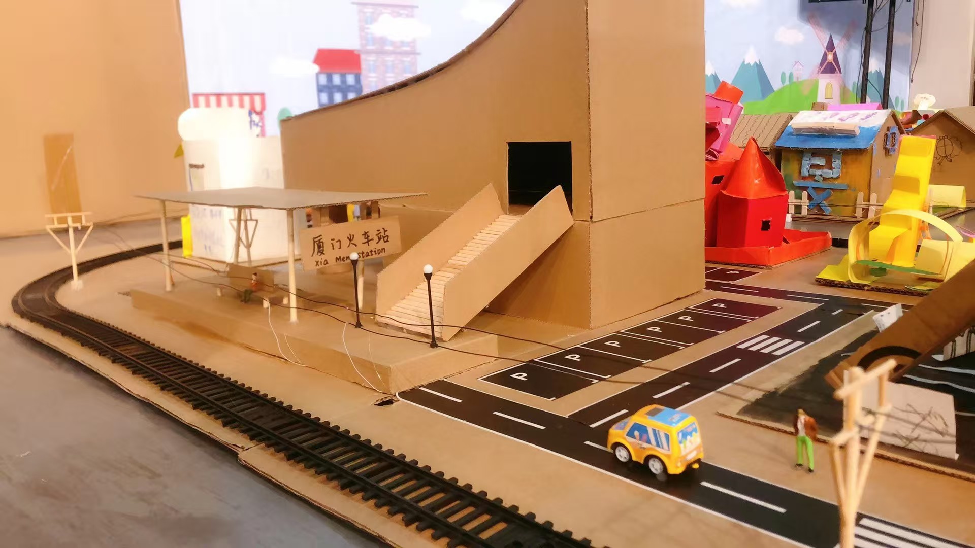 Handmade Xiamen train station model with roads and railway tracks